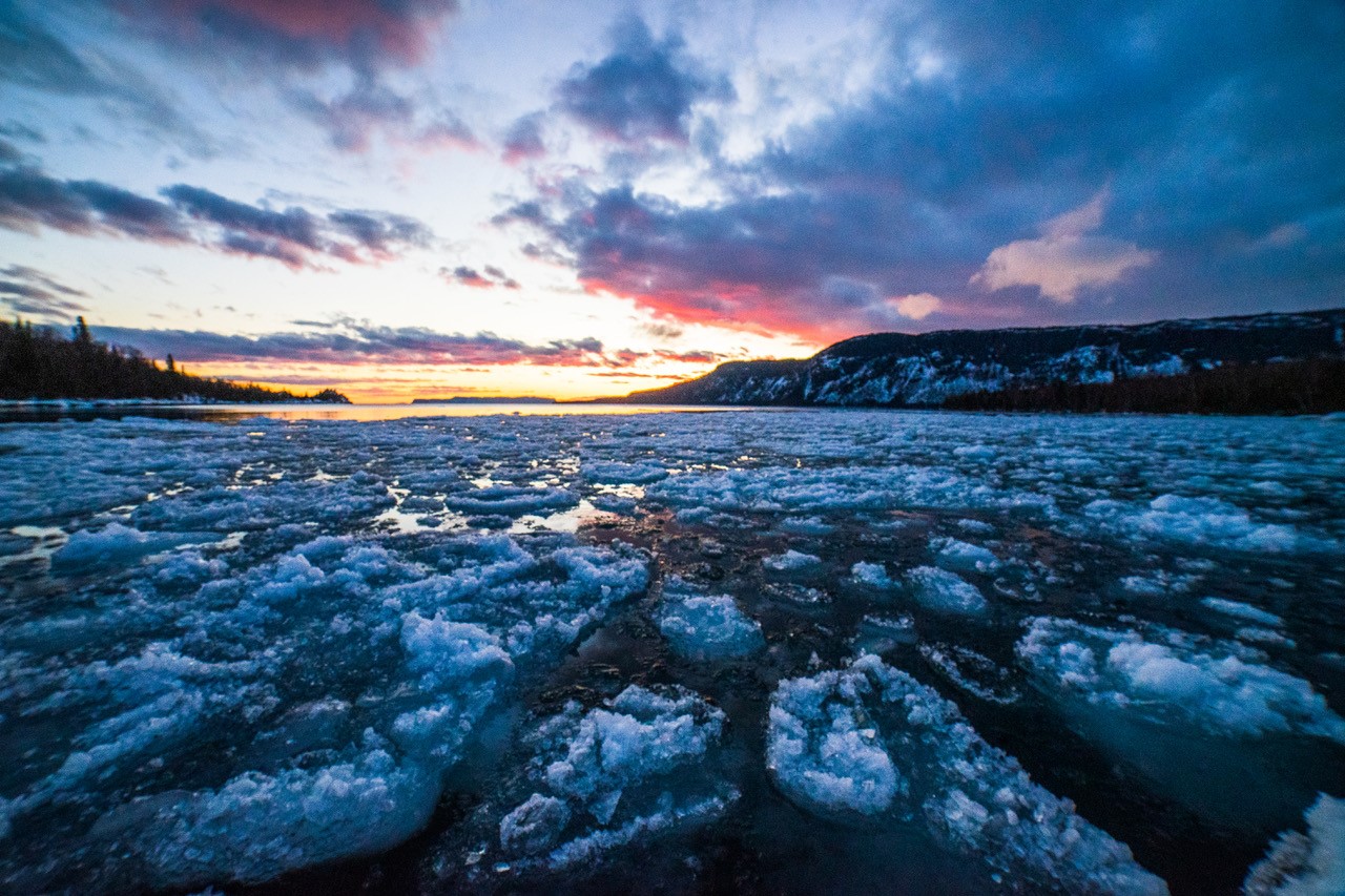 ice formations on lake at sunset