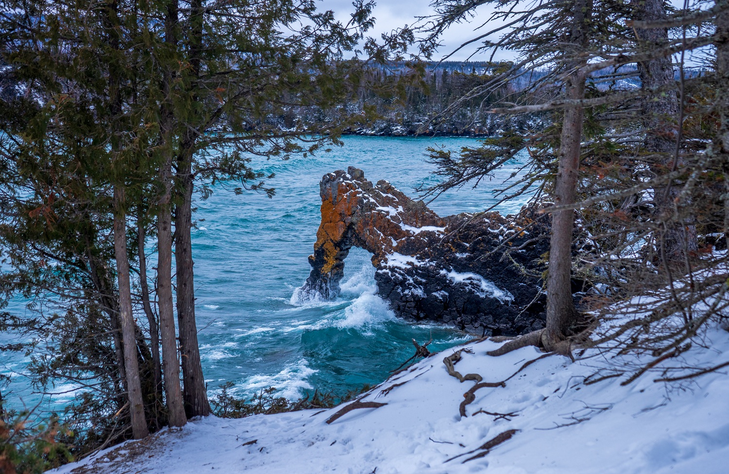 The Sea Lion -- a rock formation in Lake  Superior -- in winter surrounded by snow.