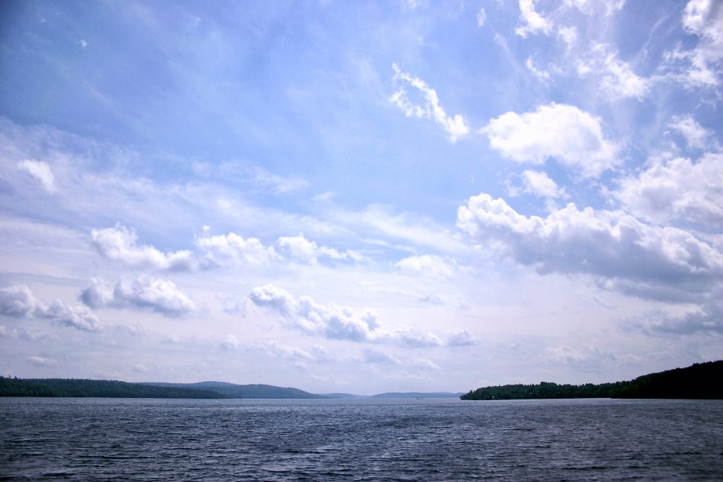 view of wide, blue sky over lake