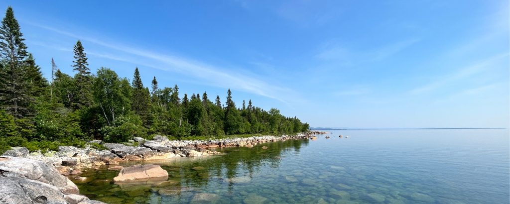 Rocky shoreline along clear lake