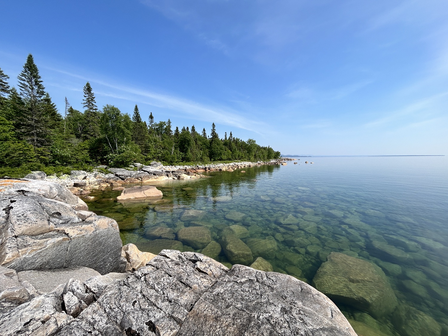 Rock shoreline along clear lake