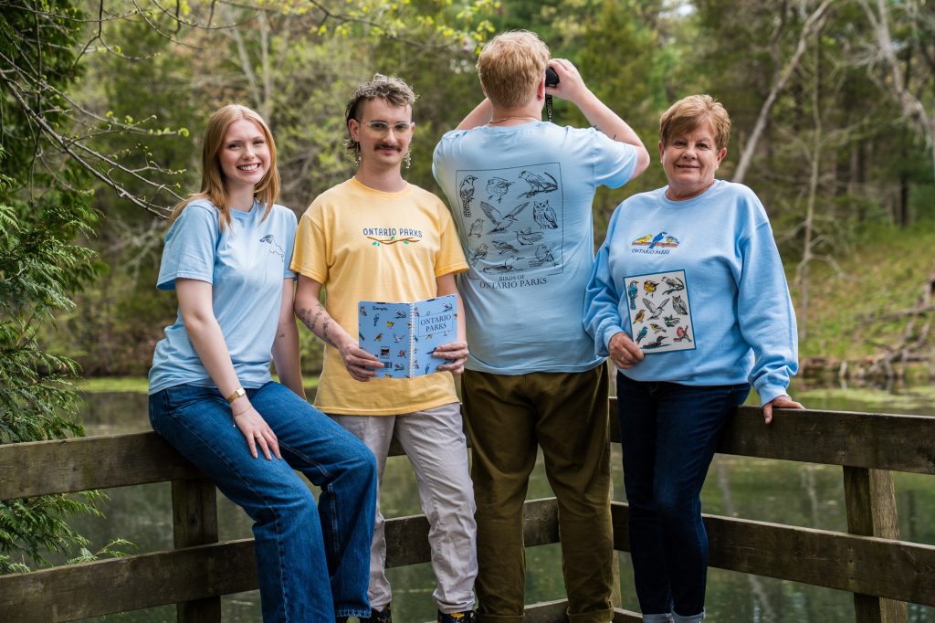 group wearing birding collection along boardwalk