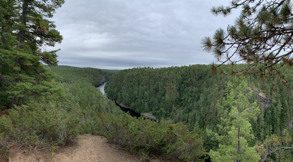 river running through forested canyon