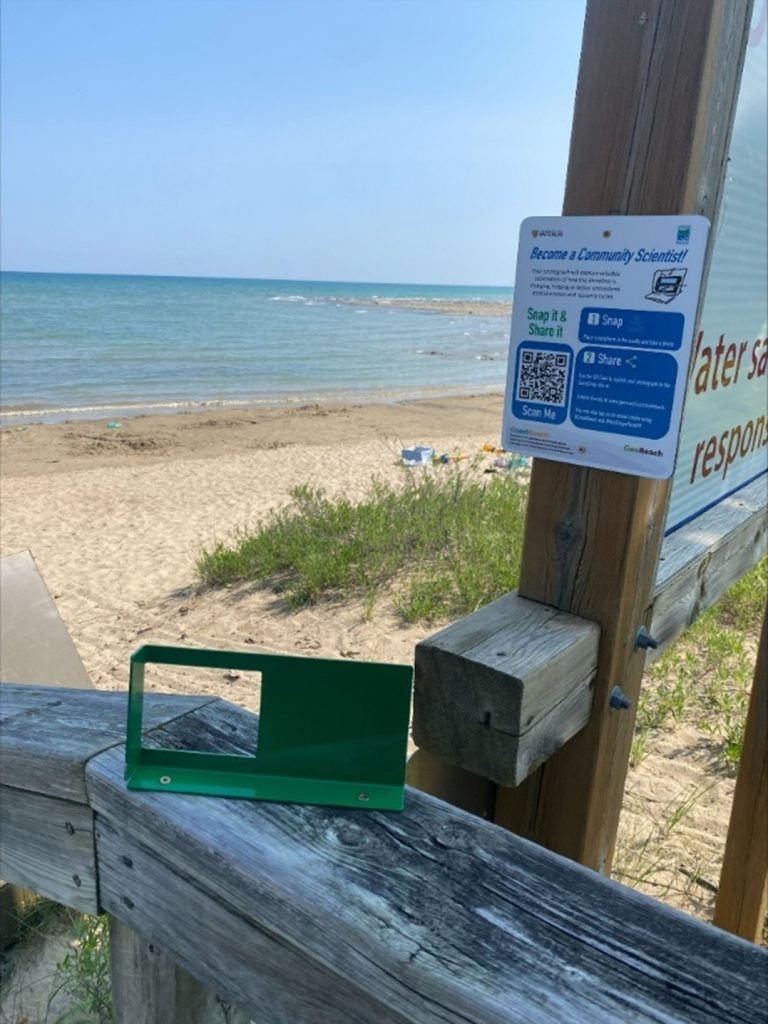 frame on wooden railway. beach in background