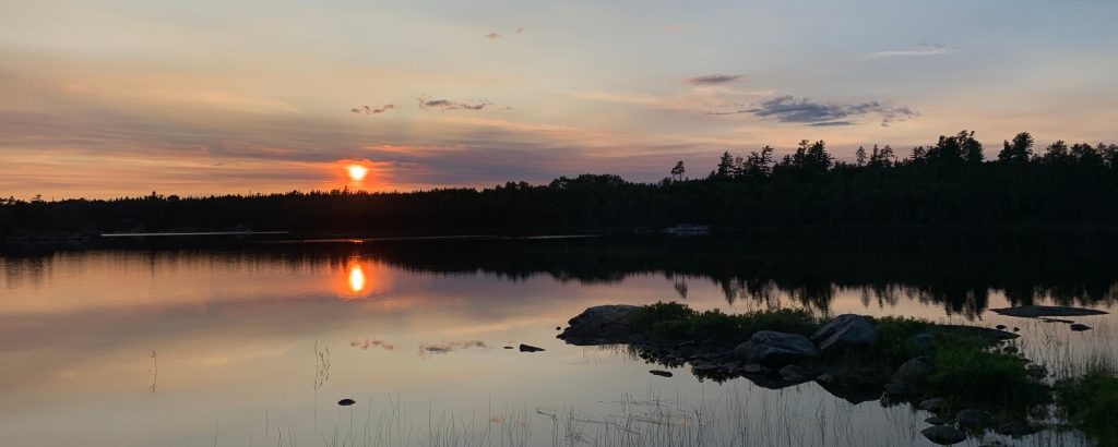 sunset over still lake