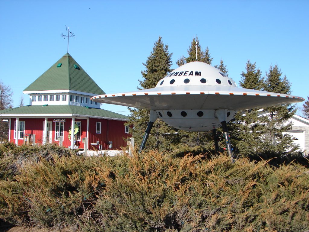 Model UFO beside building