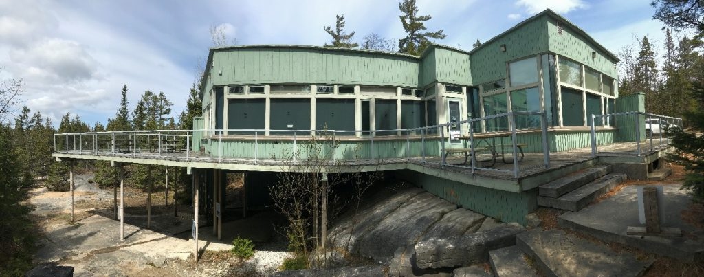 gray-green Visitor Centre on rocky landscape