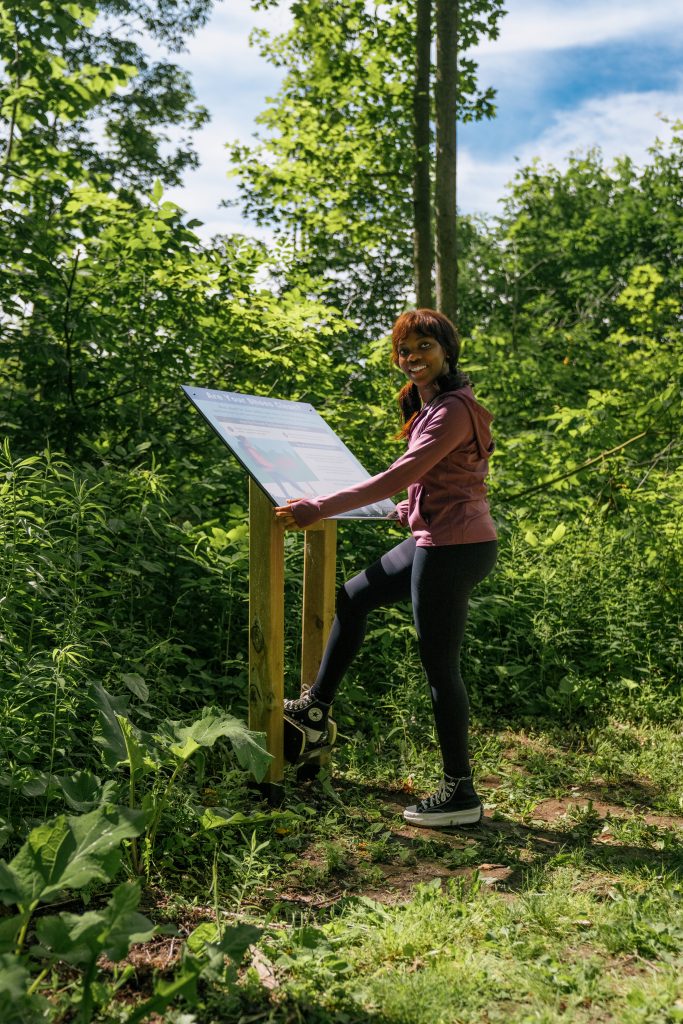 woman using boot brush station